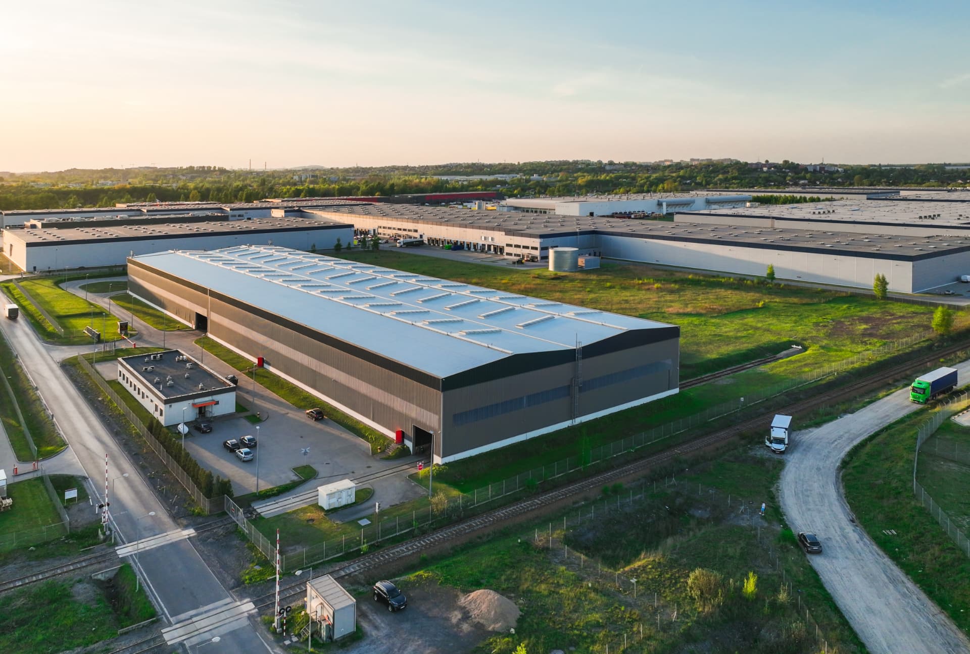 Rail-connected industrial estate in warm daylight